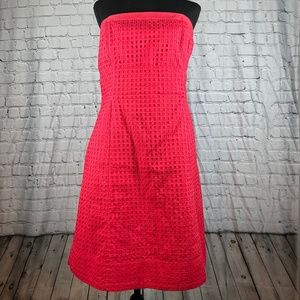Beautiful knee-length coral strapless dress with pockets